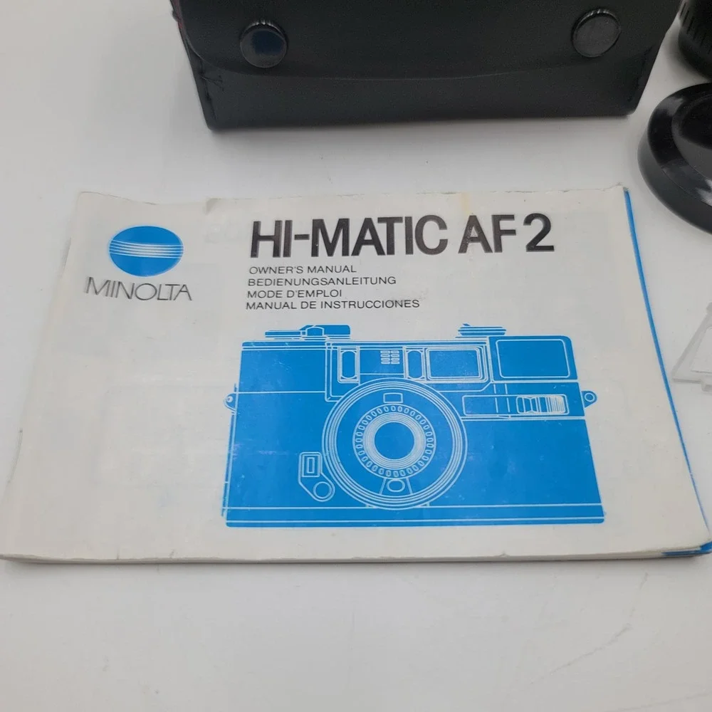 Minolta Hi-Matic AF2 35mm Film Camera Bundle with Aux Lenses Manual and Case